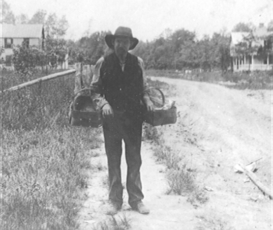 Tommy Foley making a delivery for Haring's Store - early 1900's